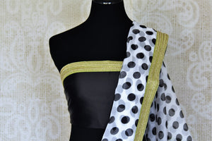 Buy beautiful white and black polka dot organza sari online in USA with embroidered border. Look beautiful on special occasions in this beautiful designer sarees, printed sarees, embroidered sarees, fancy sarees, partywear sarees from Pure Elegance Indian saree store in USA.-blouse pallu