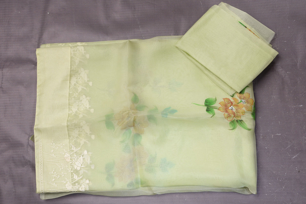 Shop stunning pastel green floral organza sari online in USA with embroidered border. Enrich your ethnic wardrobe with traditional Indian sarees, designer sarees. embroidered sarees, pure silk sarees, handwoven sarees, Kanchipuram sarees, Banarasi saris from Pure Elegance Indian saree store in USA.-blouse