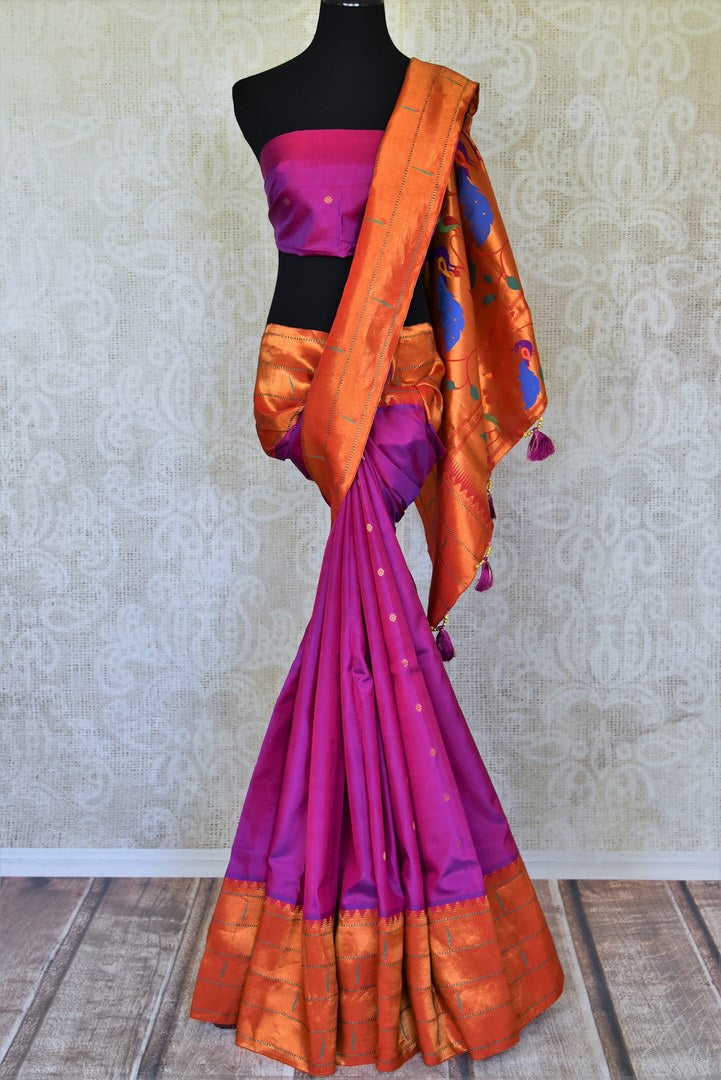 Shop stunning purple handloom silk Paithani saree online in USA with red zari border. Flaunt your sartorial choices on special occasions in stunning designer sarees, embroidered sarees, handloom sarees, Banarasi sarees, crepe sarees from Pure Elegance Indian fashion store in USA.-full view
