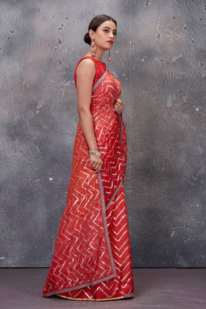 Shop stunning red chevron foil print Kota saree online in USA. Keep your ethnic wardrobe up to date with latest designer saris, pure silk sarees, handwoven sarees, tussar silk sarees, embroidered saris from Pure Elegance Indian saree store in USA.-side