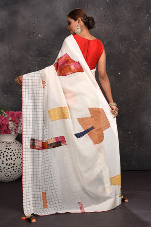 Buy beautiful off-white applique linen sari online in USA with check border. Keep your ethnic wardrobe up to date with latest designer sarees, pure silk sarees, handwoven sarees, tussar silk sarees, embroidered sarees from Pure Elegance Indian saree store in USA.-back