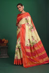 Shop beautiful cream printed Gadhwal sari online in USA with red zari border. Keep your ethnic wardrobe up to date with latest designer sarees, pure silk sarees, handwoven sarees, tussar silk sarees, embroidered sarees, organza saris from Pure Elegance Indian saree store in USA.-full view
