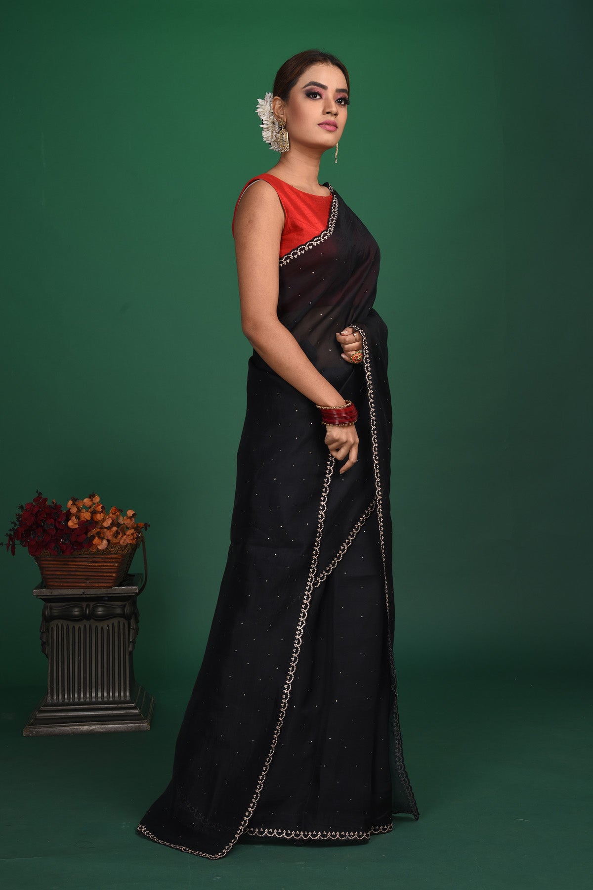 Shop this exquisite black saree in soft organza with heavy lace border online in USA which is made of organza fabric and lightweight. This organza Saree is beautified with lace work and latest trend. Ideal for casual, kitty parties, stylish accessories. Shop this from Pure Elegance Indian fashion store in USA.-Side view.