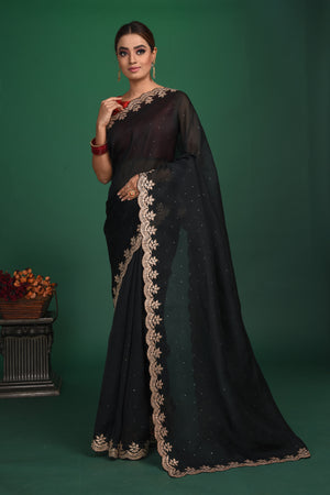 Buy this exquisite black saree in soft organza with heavy lace border online in USA which is made of organza fabric and lightweight. This organza Saree is beautified with lace work and latest trend. Ideal for casual, kitty parties, stylish accessories. Shop this from Pure Elegance Indian fashion store in USA.-Full view with open pallu.