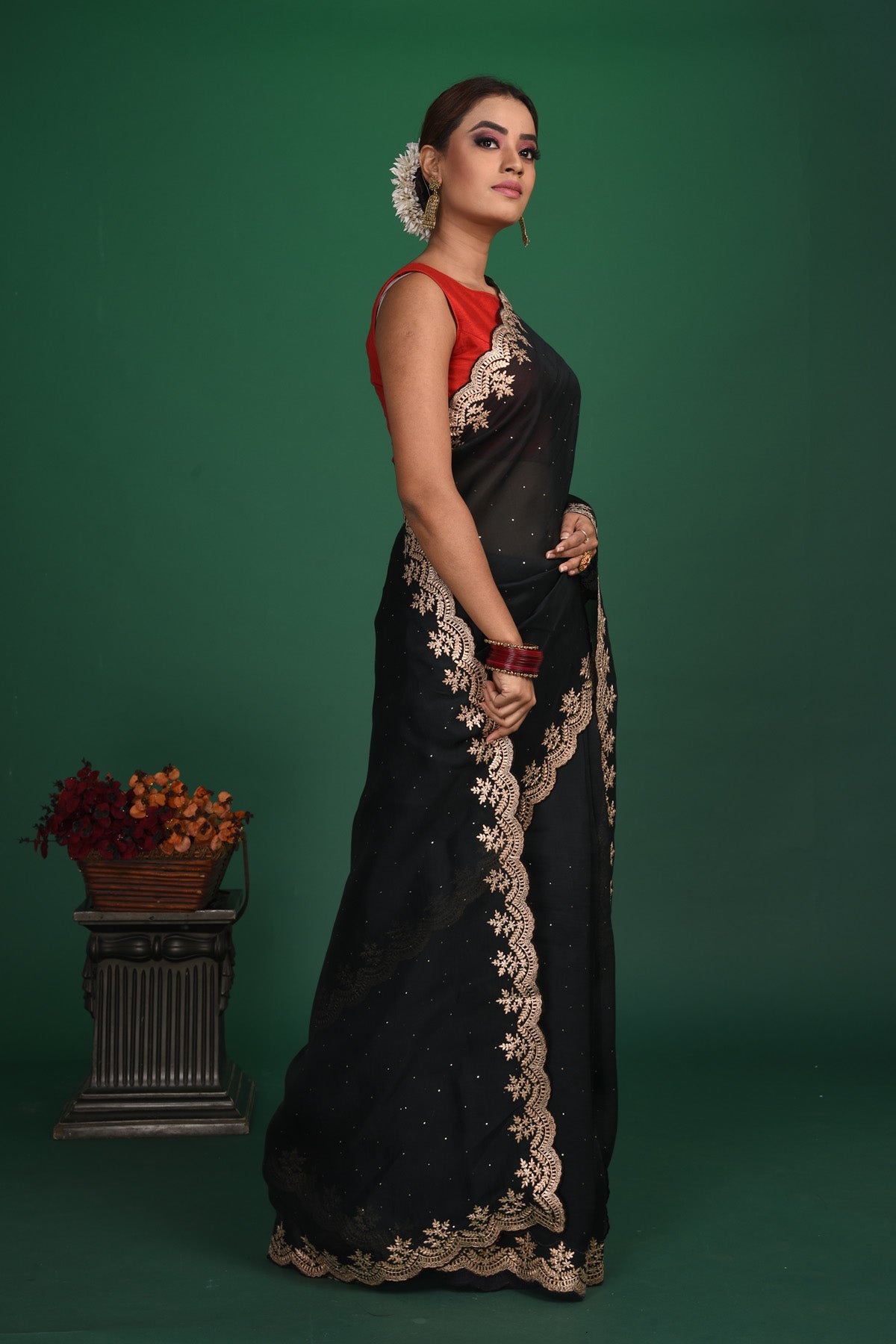 Buy this exquisite black saree in soft organza with heavy lace border online in USA which is made of organza fabric and lightweight. This organza Saree is beautified with lace work and latest trend. Ideal for casual, kitty parties, stylish accessories. Shop this from Pure Elegance Indian fashion store in USA.-Side view.