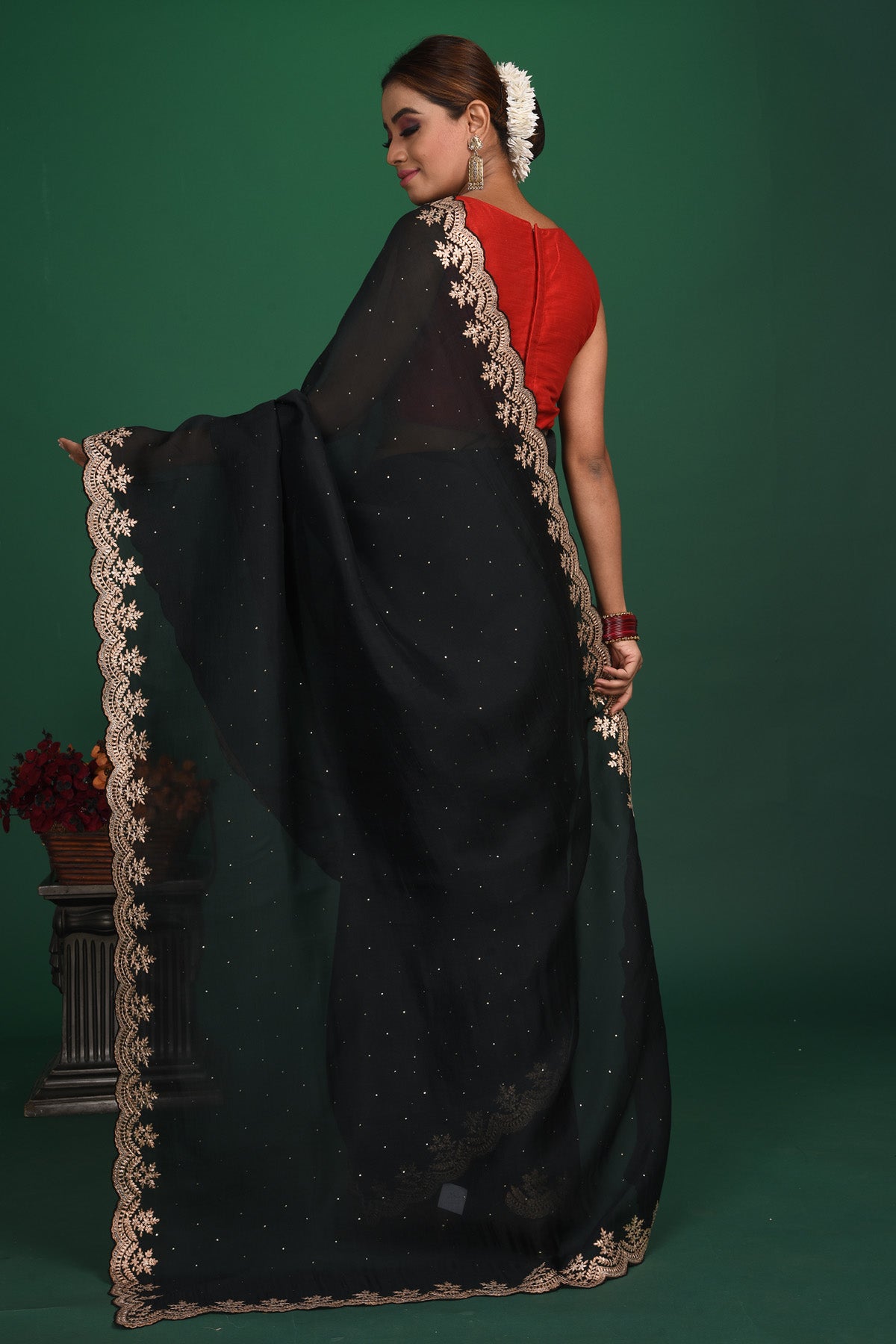 Buy this exquisite black saree in soft organza with heavy lace border online in USA which is made of organza fabric and lightweight. This organza Saree is beautified with lace work and latest trend. Ideal for casual, kitty parties, stylish accessories. Shop this from Pure Elegance Indian fashion store in USA.-Back view with open pallu.