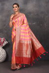 Buy this classy red banarasi silk brocade woven diagonal stripes and floral saree online in USA which has beautiful zari work all over the heavy border and end with handmade latkan. Pair this royal banarasi handloom brocade woven saree with your designer blouse and a potli bag from Pure Elegance Indian fashion store in USA.- Full view.