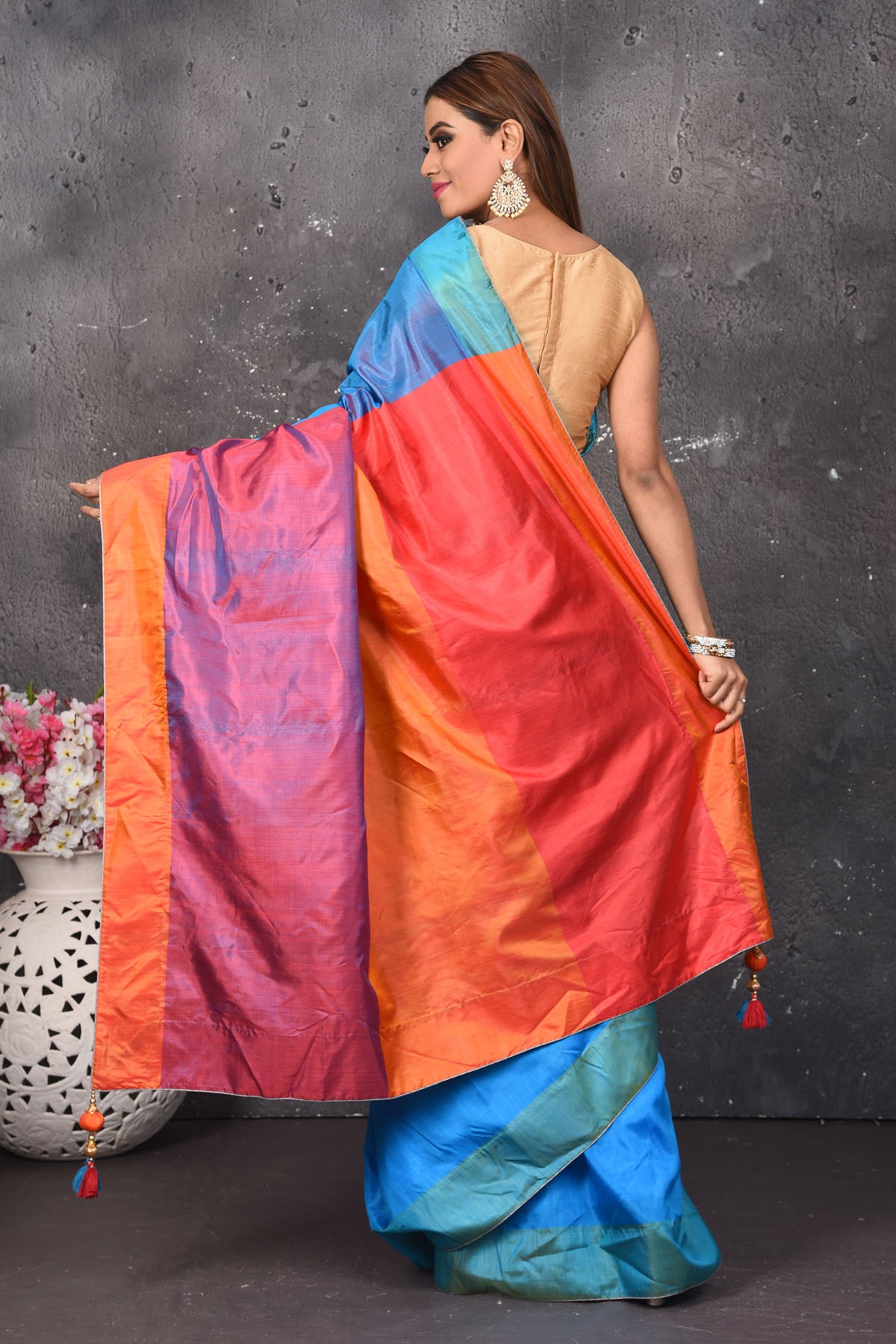 Shop stunning blue matka silk saree online in USA with orange and purple pallu. Keep your ethnic wardrobe up to date with latest designer sarees, pure silk sarees, Kanchipuram silk sarees, handwoven saris, tussar silk sarees, embroidered saris from Pure Elegance Indian saree store in USA.-back