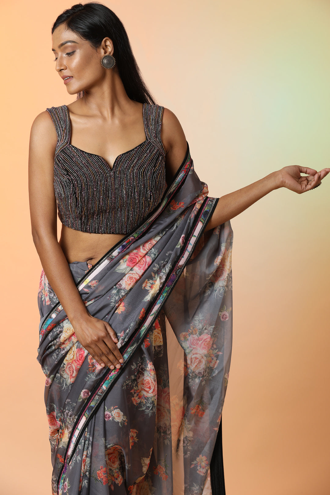 Buy stunning grey floral crepe saree online in USA with embellished saree blouse. Radiate glamor on special occasions in exquisite designer sarees, embroidered sarees, partywear saris, Bollywood sarees, fancy sarees from from Pure Elegance Indian saree store in USA.-closeup