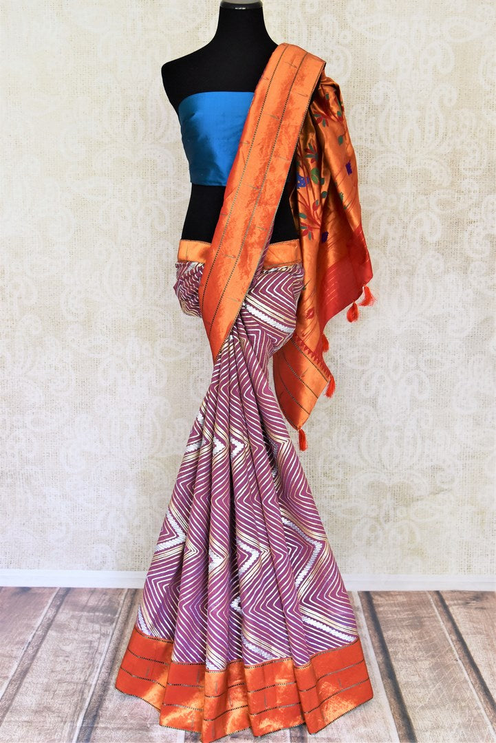 Shop beautiful purple gota work Paithani saree online in USA. Keep your ethnic wardrobe up to date with latest designer sarees, pure silk sarees, handwoven sarees, tussar silk sarees, embroidered saris, Paithani sarees from Pure Elegance Indian saree store in USA.-full view