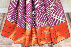 Shop beautiful purple gota work Paithani saree online in USA. Keep your ethnic wardrobe up to date with latest designer sarees, pure silk sarees, handwoven sarees, tussar silk sarees, embroidered saris, Paithani sarees from Pure Elegance Indian saree store in USA.-pleats