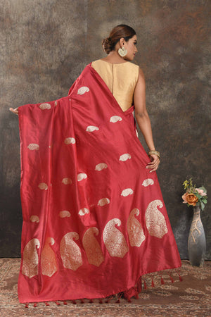 Buy beautiful red silk saree online in USA with silver zari paisley buta. Be vision of elegance on special occasions in exquisite designer sarees, handwoven sarees, georgette sarees, embroidered sarees, Banarasi sarees from Pure Elegance Indian saree store in USA.-back