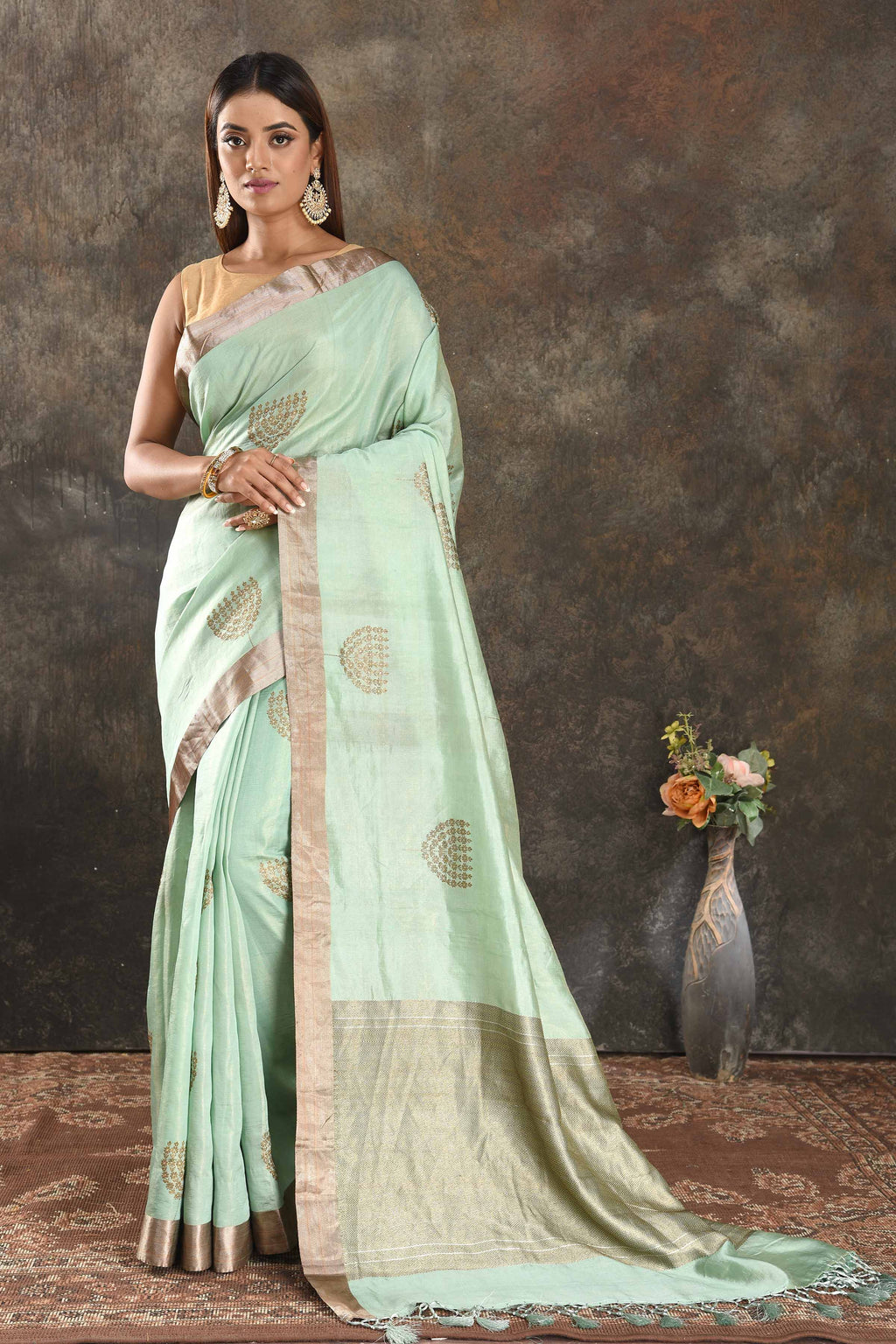 Shop elegant pastel green muga silk sari online in USA with zari border. Be vision of elegance on special occasions in exquisite designer sarees, handwoven sarees, georgette sarees, embroidered sarees, Banarasi sarees from Pure Elegance Indian saree store in USA.-full view