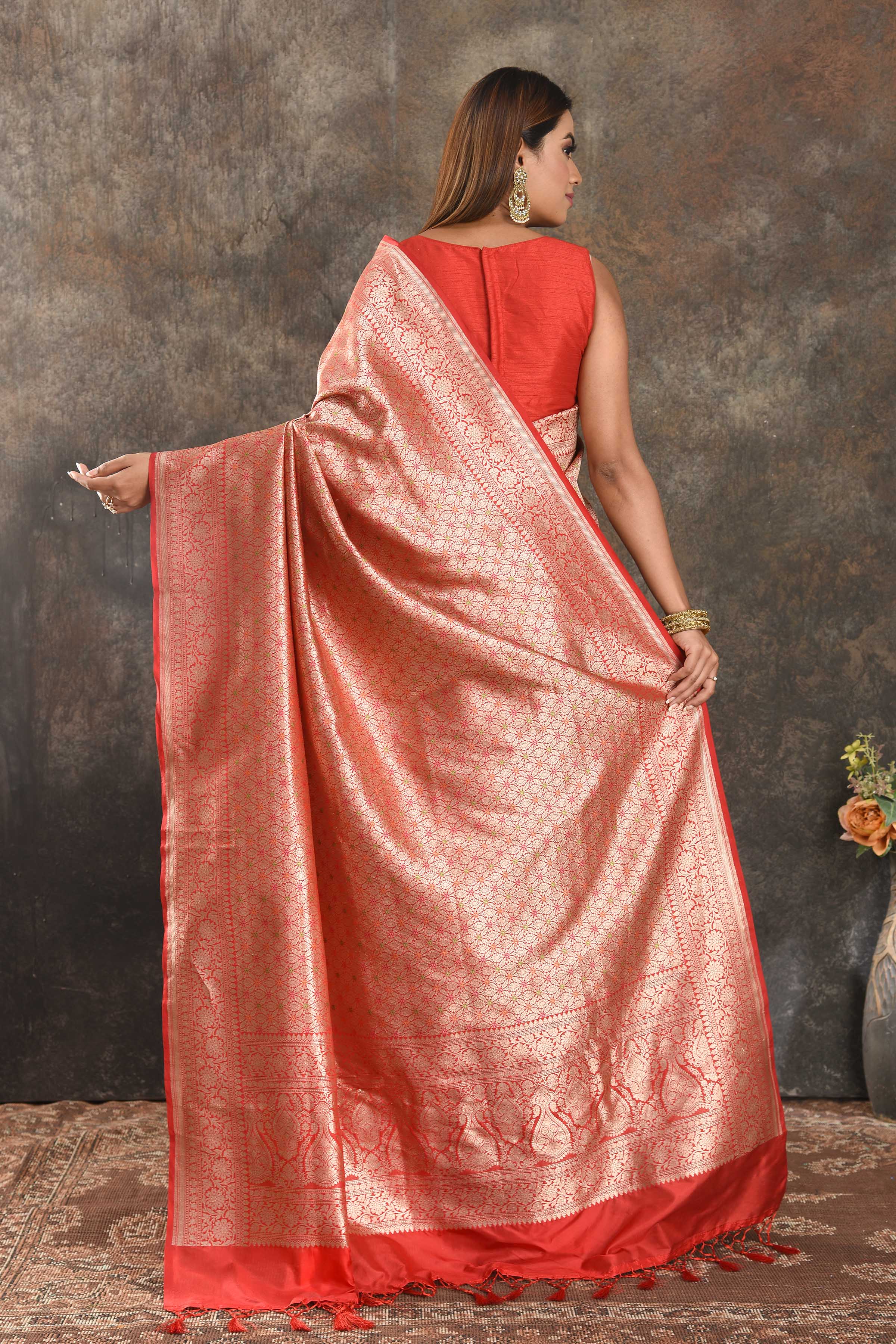Shop beautiful red silk saree online in USA with heavy zari work. Be vision of elegance on special occasions in exquisite designer sarees, handwoven sarees, georgette sarees, embroidered sarees, Banarasi saree, pure silk saris from Pure Elegance Indian saree store in USA.-back
