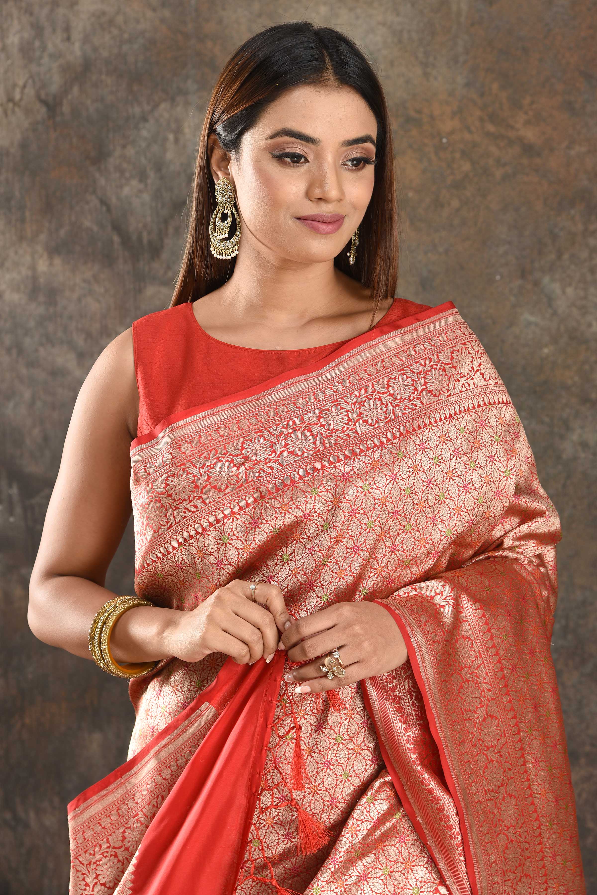 Shop beautiful red silk saree online in USA with heavy zari work. Be vision of elegance on special occasions in exquisite designer sarees, handwoven sarees, georgette sarees, embroidered sarees, Banarasi saree, pure silk saris from Pure Elegance Indian saree store in USA.-closeup