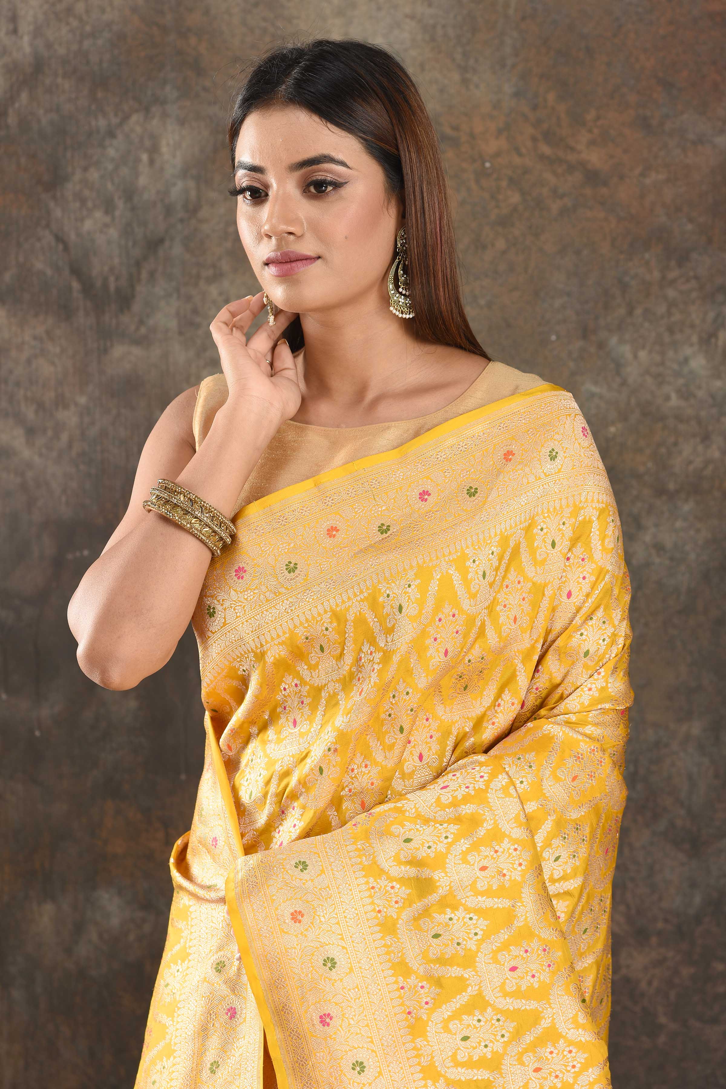 Shop yellow Katan silk Banarasi sari online in USA with zari work. Be vision of elegance on special occasions in exquisite designer sarees, handwoven sarees, georgette sarees, embroidered sarees, Banarasi saree, pure silk saris, tussar sarees from Pure Elegance Indian saree store in USA.-closeup