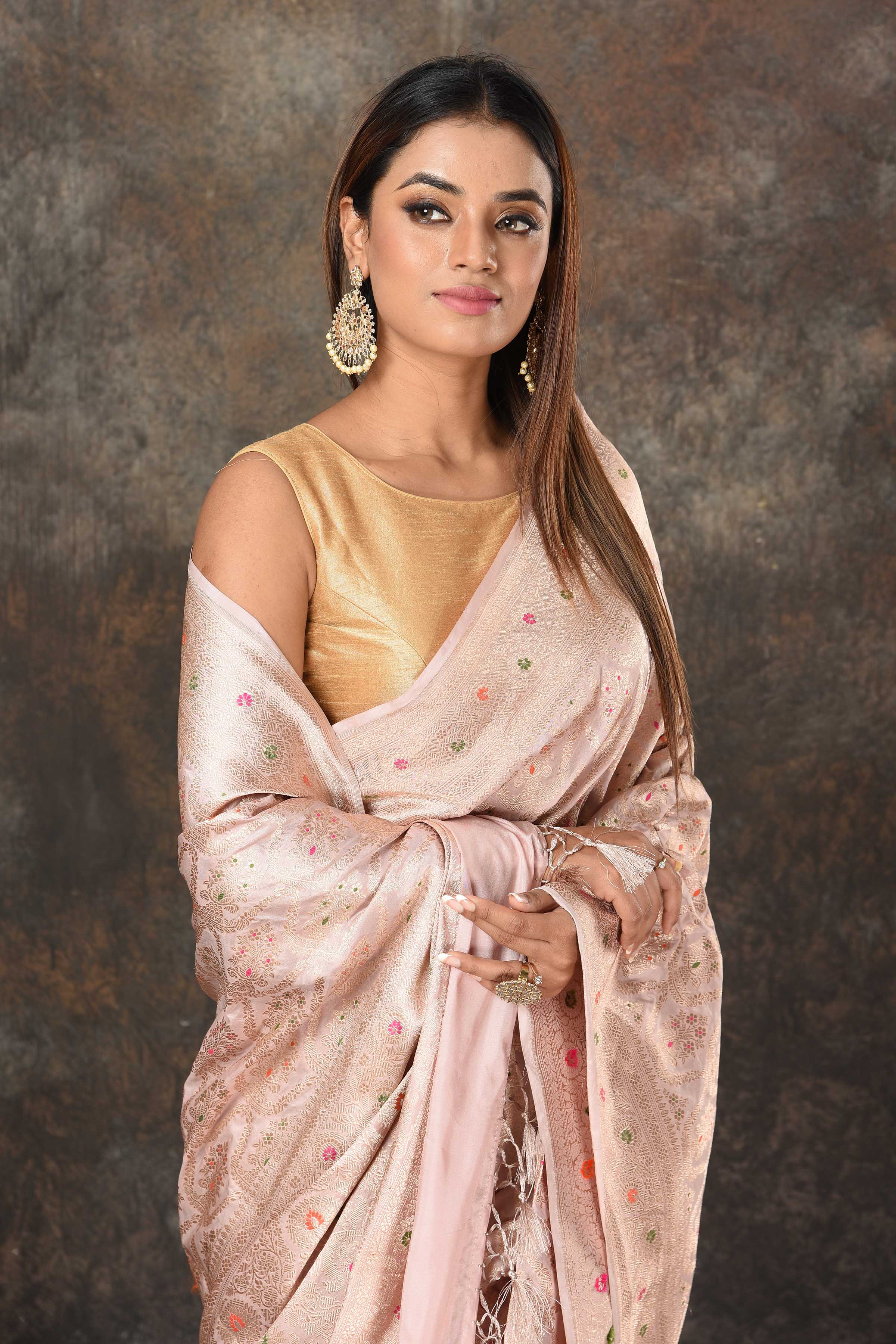 Shop beautiful powder pink Benarasi sari online in USA with zari minakari jaal. Look royal at weddings and festive occasions in exquisite Banarasi saris, handwoven sarees, tussar silk sarees, Bollywood sarees, partywear sarees from Pure Elegance Indian saree store in USA.-closeup