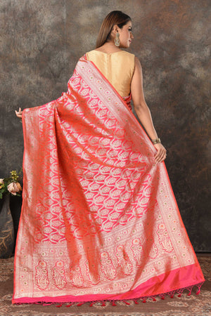 Shop bright pink Banarsi sari online in USA with zari minakari jaal. Look royal at weddings and festive occasions in exquisite Banarasi saris, handwoven sarees, tussar silk sarees, Bollywood sarees, partywear sarees from Pure Elegance Indian saree store in USA.-back