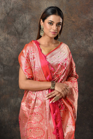 Shop bright pink Banarsi sari online in USA with zari minakari jaal. Look royal at weddings and festive occasions in exquisite Banarasi saris, handwoven sarees, tussar silk sarees, Bollywood sarees, partywear sarees from Pure Elegance Indian saree store in USA.-closeup