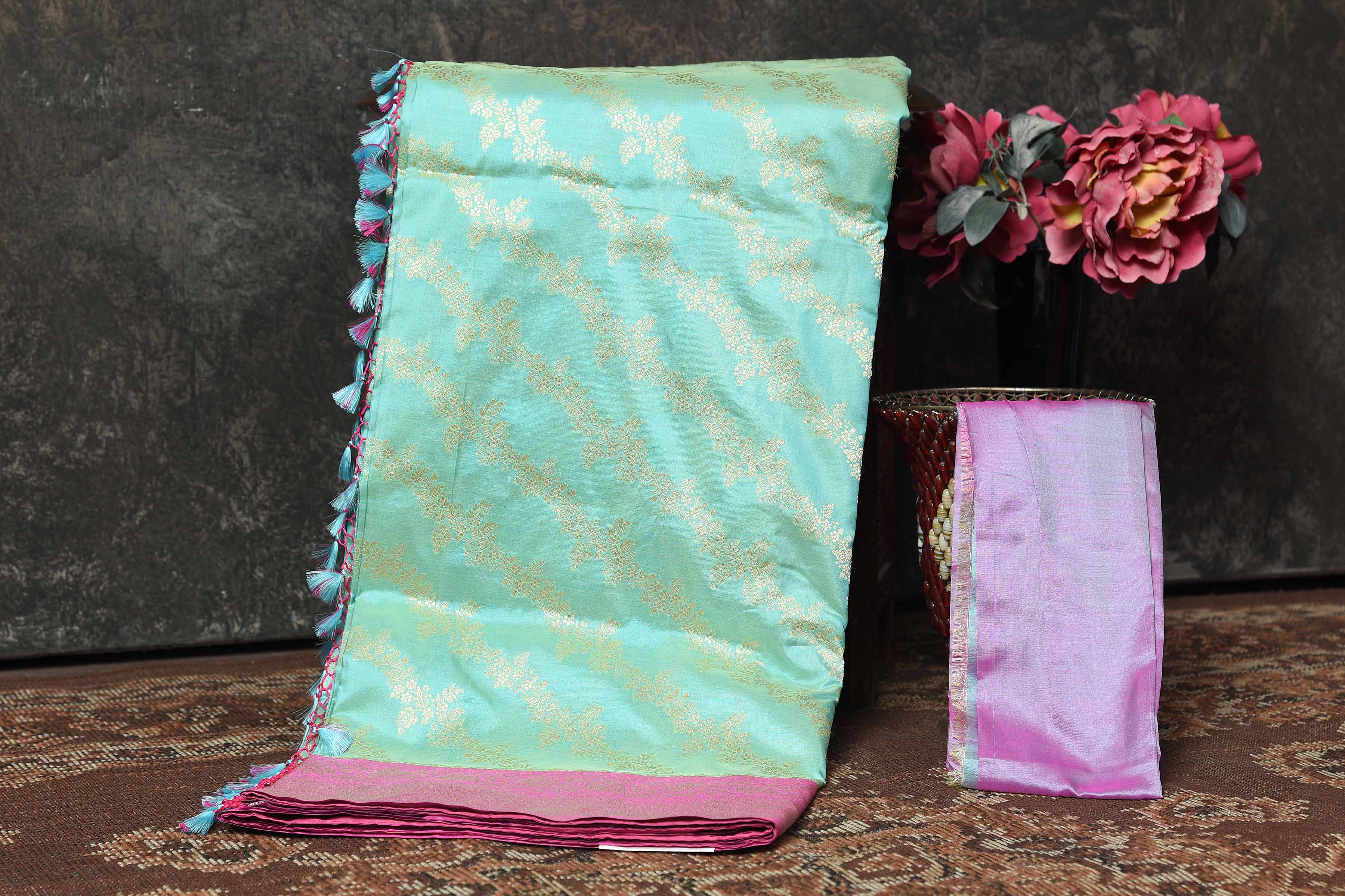 Buy beautiful pastel green Banarasi Mashru silk saree online in USA with pink border. Radiate elegance on special occasions in exquisite designer sarees, handwoven sarees, georgette sarees, embroidered sarees, Banarasi saree, pure silk saris, tussar sarees from Pure Elegance Indian saree store in USA.-blouse