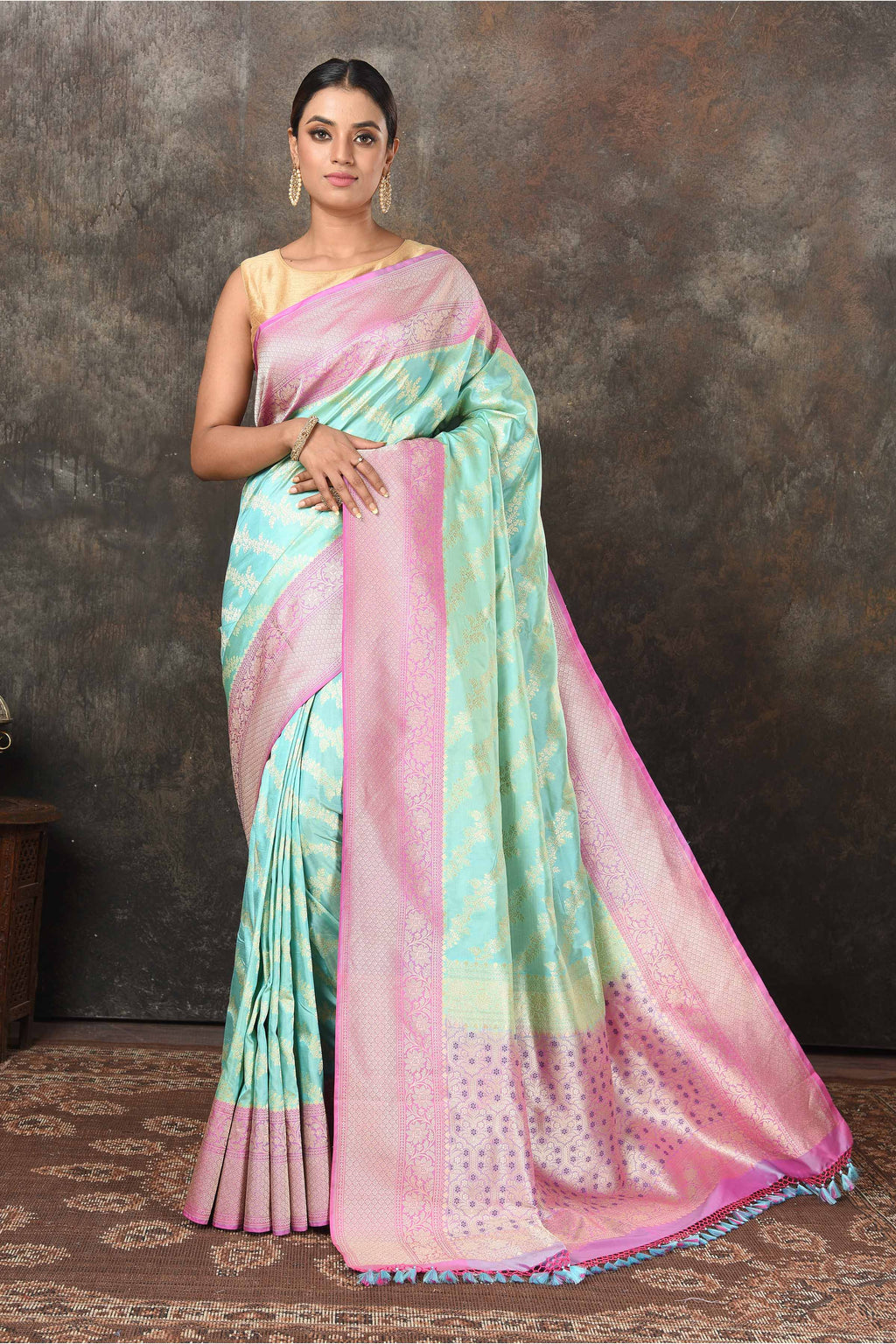 Buy beautiful pastel green Banarasi Mashru silk saree online in USA with pink border. Radiate elegance on special occasions in exquisite designer sarees, handwoven sarees, georgette sarees, embroidered sarees, Banarasi saree, pure silk saris, tussar sarees from Pure Elegance Indian saree store in USA.-full view