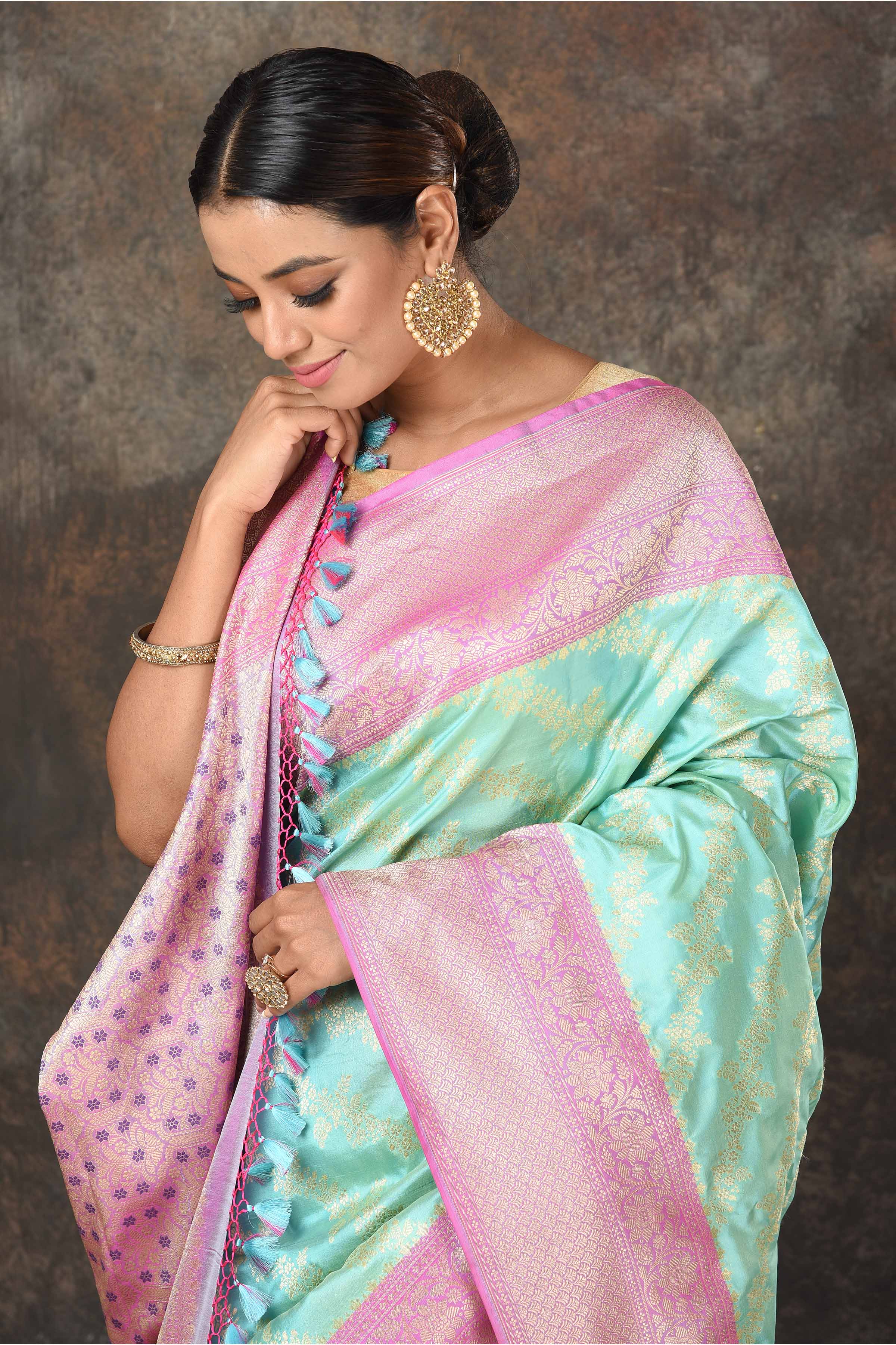 Buy beautiful pastel green Banarasi Mashru silk saree online in USA with pink border. Radiate elegance on special occasions in exquisite designer sarees, handwoven sarees, georgette sarees, embroidered sarees, Banarasi saree, pure silk saris, tussar sarees from Pure Elegance Indian saree store in USA.-closeup