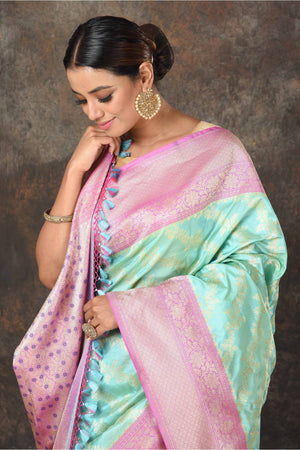 Buy beautiful pastel green Banarasi Mashru silk saree online in USA with pink border. Radiate elegance on special occasions in exquisite designer sarees, handwoven sarees, georgette sarees, embroidered sarees, Banarasi saree, pure silk saris, tussar sarees from Pure Elegance Indian saree store in USA.-closeup