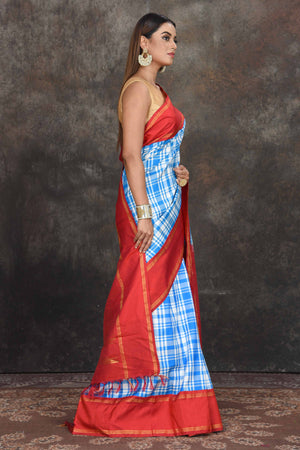 Buy beautiful white and blue check Kanjeevaram sari online in USA with red zari border. Go for a rich traditional look on weddings and festive occasions in pure silk sarees, Kanchipuram silk sarees, handloom sarees, Banarasi sarees from Pure Elegance Indian fashion store in USA.-side