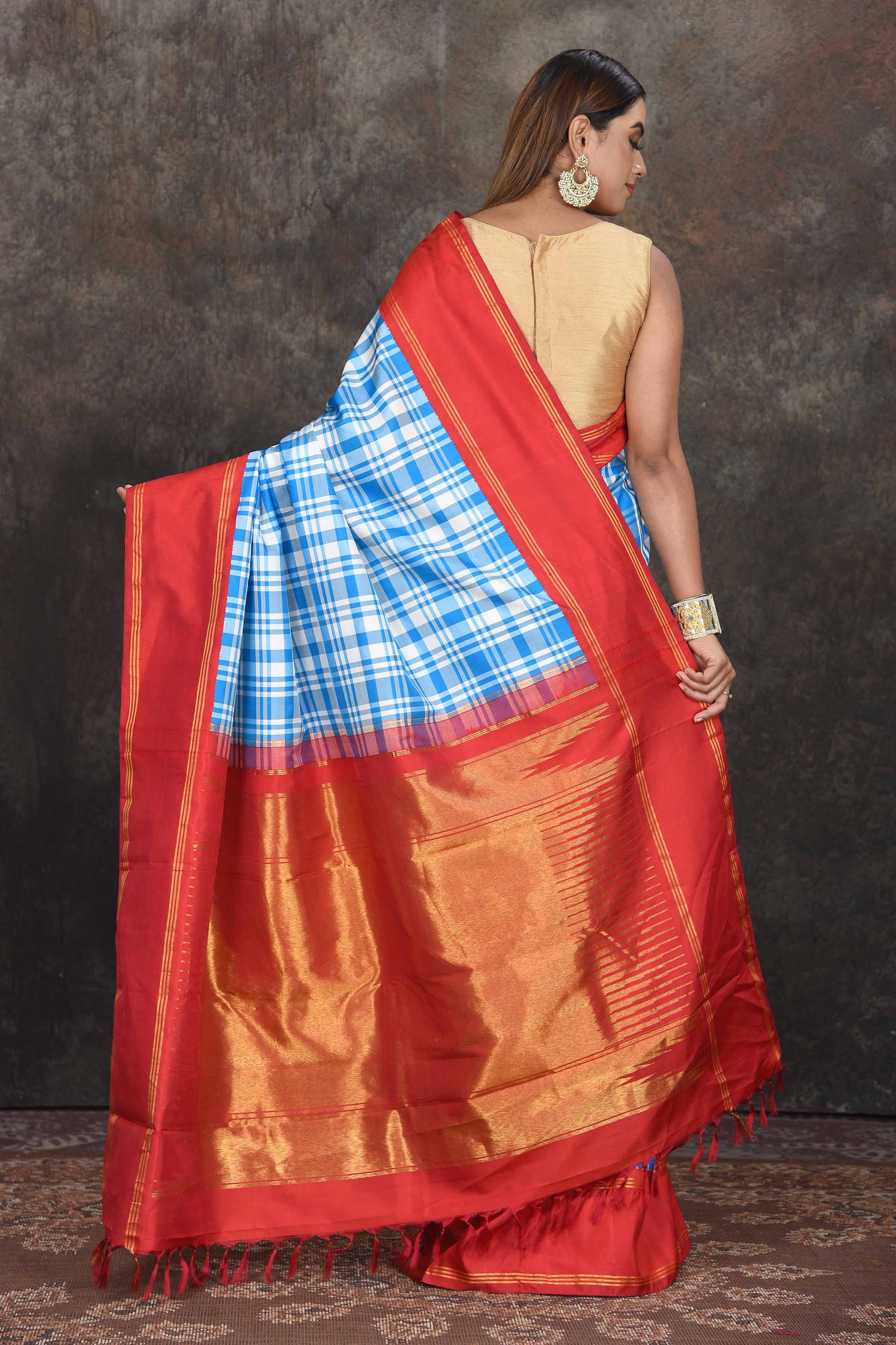 Buy beautiful white and blue check Kanjeevaram sari online in USA with red zari border. Go for a rich traditional look on weddings and festive occasions in pure silk sarees, Kanchipuram silk sarees, handloom sarees, Banarasi sarees from Pure Elegance Indian fashion store in USA.-back