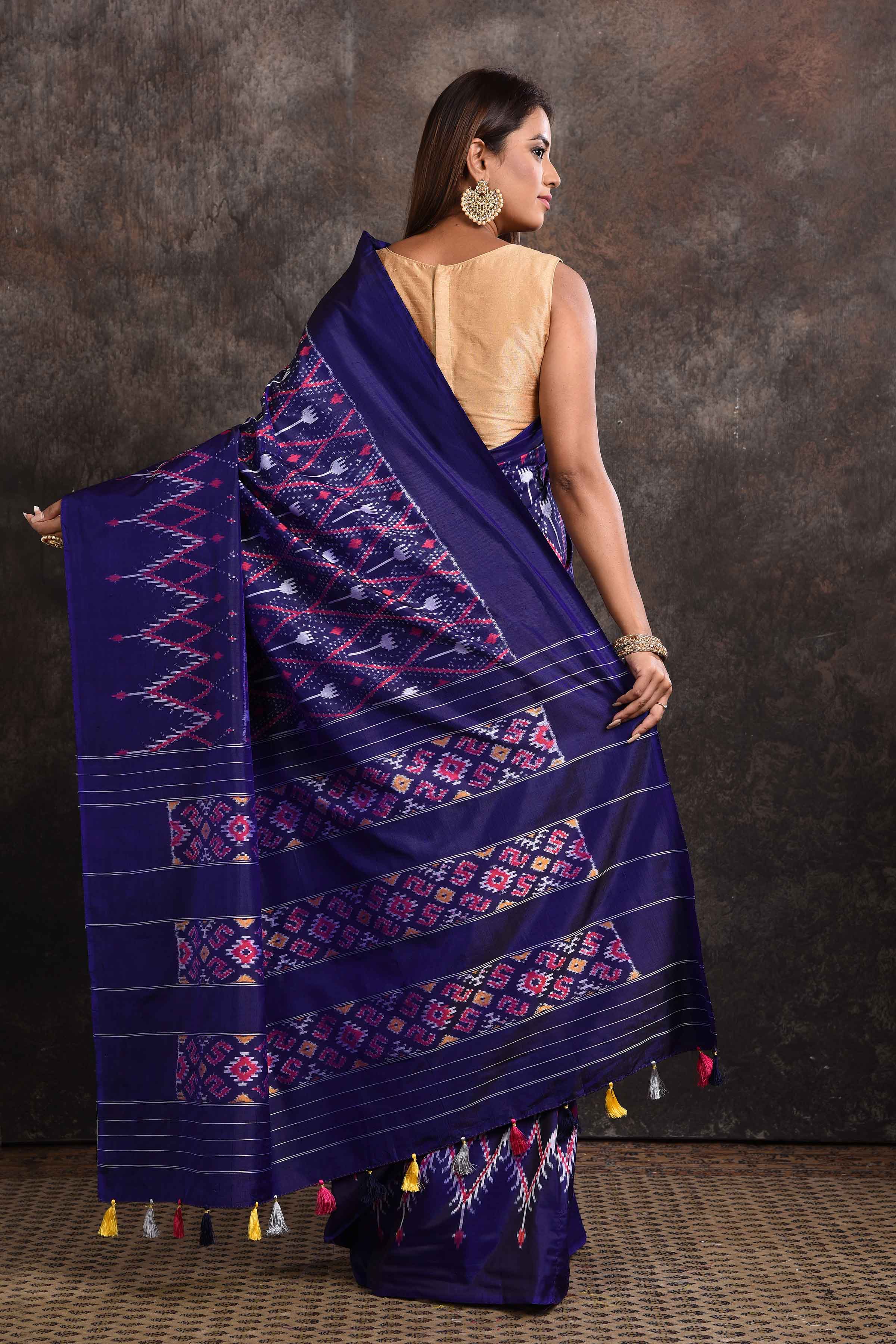 Shop stunning navy blue ikkat silk saree online in USA with zari stripes pallu. Look your ethnic best on festive occasions with latest designer sarees, pure silk sarees, Kanchipuram silk sarees, handwoven sarees, tussar silk sarees, embroidered sarees from Pure Elegance Indian saree store in USA.-back