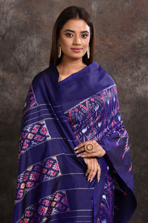 Shop stunning navy blue ikkat silk saree online in USA with zari stripes pallu. Look your ethnic best on festive occasions with latest designer sarees, pure silk sarees, Kanchipuram silk sarees, handwoven sarees, tussar silk sarees, embroidered sarees from Pure Elegance Indian saree store in USA.-closeup