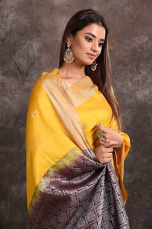 Shop stunning yellow Kanjeevaram silk sari online in USA with black zari pallu. Keep your ethnic wardrobe up to date with latest designer sarees, pure silk sarees, Kanchipuram silk sarees, handwoven sarees, tussar silk sarees, embroidered sarees from Pure Elegance Indian saree store in USA.-closeup