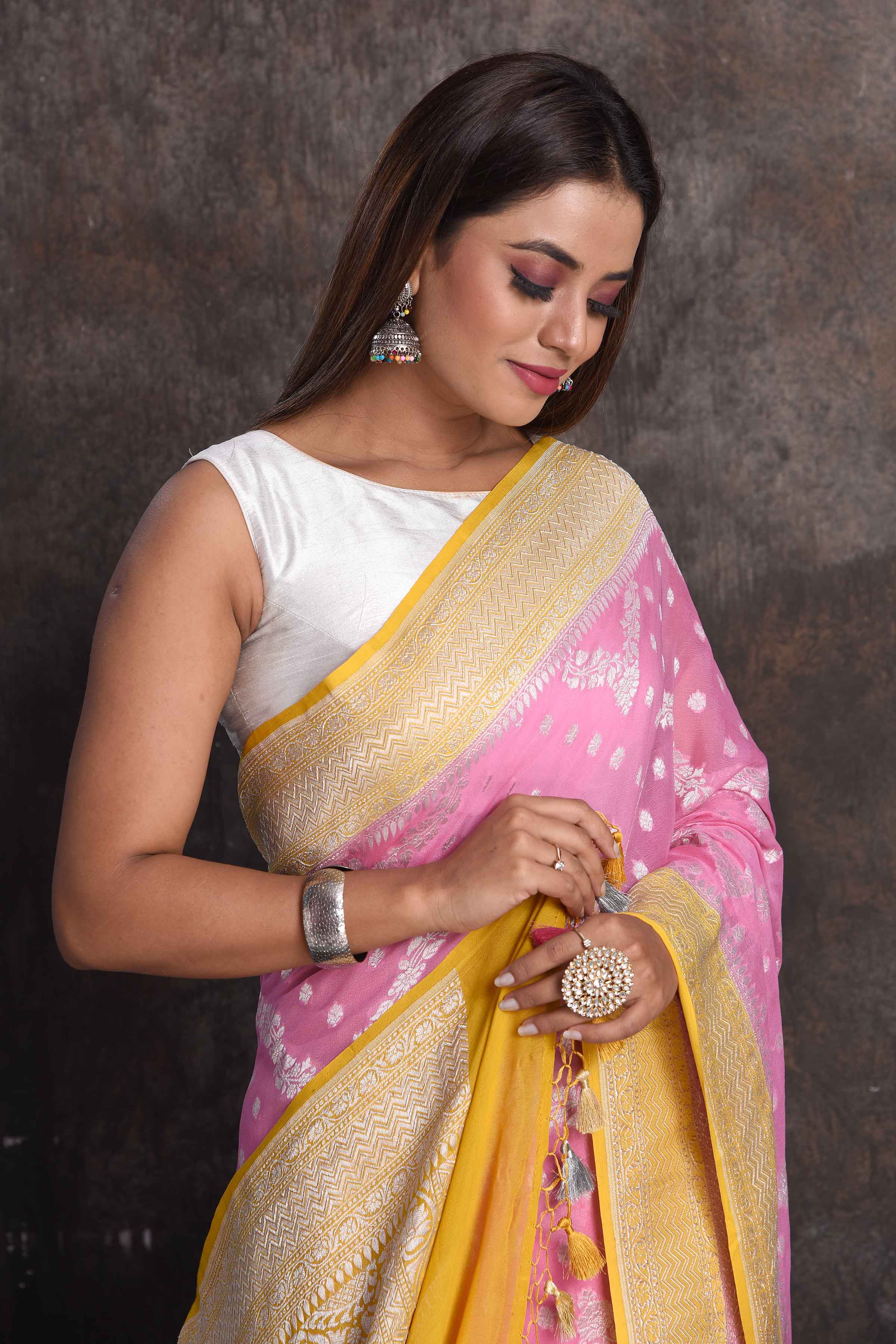 Buy beautiful pastel pink georgette Banarasi saree online in USA with mustard border, Be a vision of ethnic elegance on festive occasions in beautiful designer sarees, silk sarees, handloom sarees, Kanchipuram silk sarees, embroidered sarees from Pure Elegance Indian saree store in USA. -closeup