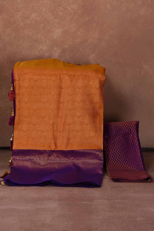 Buy orange Kanjeevaram silk sari online in USA with purple zari border. Keep your ethnic wardrobe up to date with latest designer sarees, pure silk saris, Kanchipuram silk sarees, handwoven sarees, tussar silk saris, embroidered sarees, soft silk sarees, Kora silk sarees from Pure Elegance Indian saree store in USA.-blouse