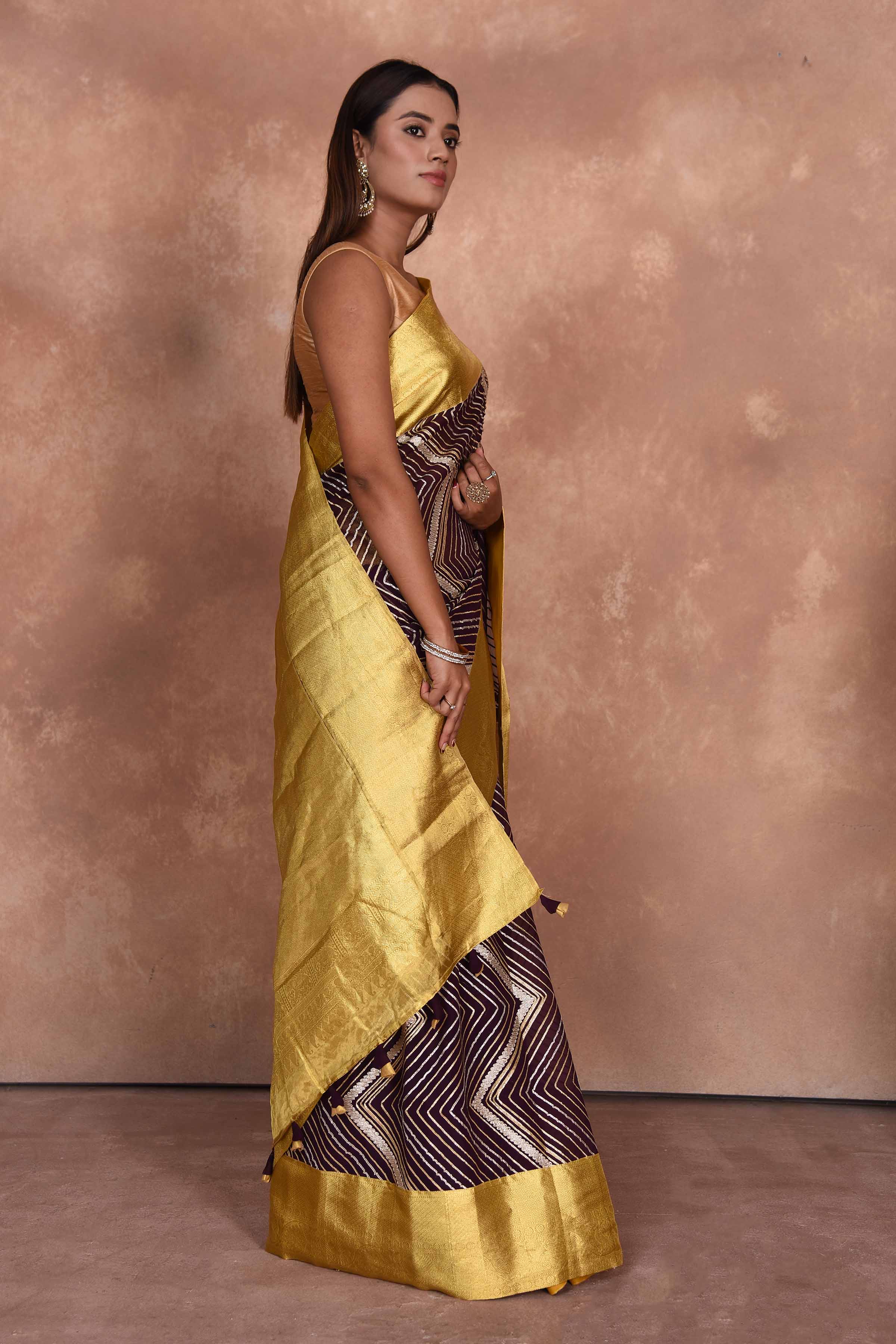 Shop brown Kanjeevaram georgette sari online in USA with gota work. Keep your ethnic wardrobe up to date with latest designer sarees, pure silk saris, Kanchipuram silk sarees, handwoven sarees, tussar silk saris, embroidered sarees, soft silk sarees, Kora silk sarees from Pure Elegance Indian saree store in USA.-side