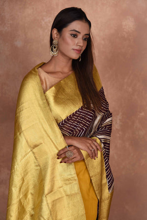 Shop brown Kanjeevaram georgette sari online in USA with gota work. Keep your ethnic wardrobe up to date with latest designer sarees, pure silk saris, Kanchipuram silk sarees, handwoven sarees, tussar silk saris, embroidered sarees, soft silk sarees, Kora silk sarees from Pure Elegance Indian saree store in USA.-closeup