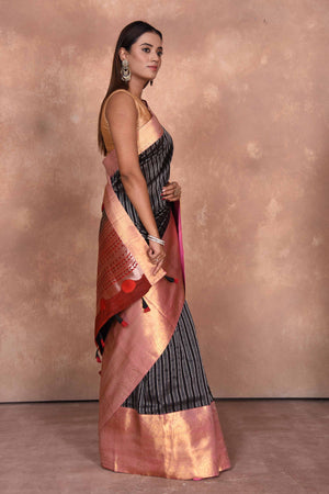 Buy black striped Kanjeevaram Kora sari online in USA with red zari border. Keep your ethnic wardrobe up to date with latest designer sarees, pure silk saris, Kanchipuram silk sarees, handwoven sarees, tussar silk saris, embroidered sarees, soft silk sarees, Kora silk sarees from Pure Elegance Indian saree store in USA.-side