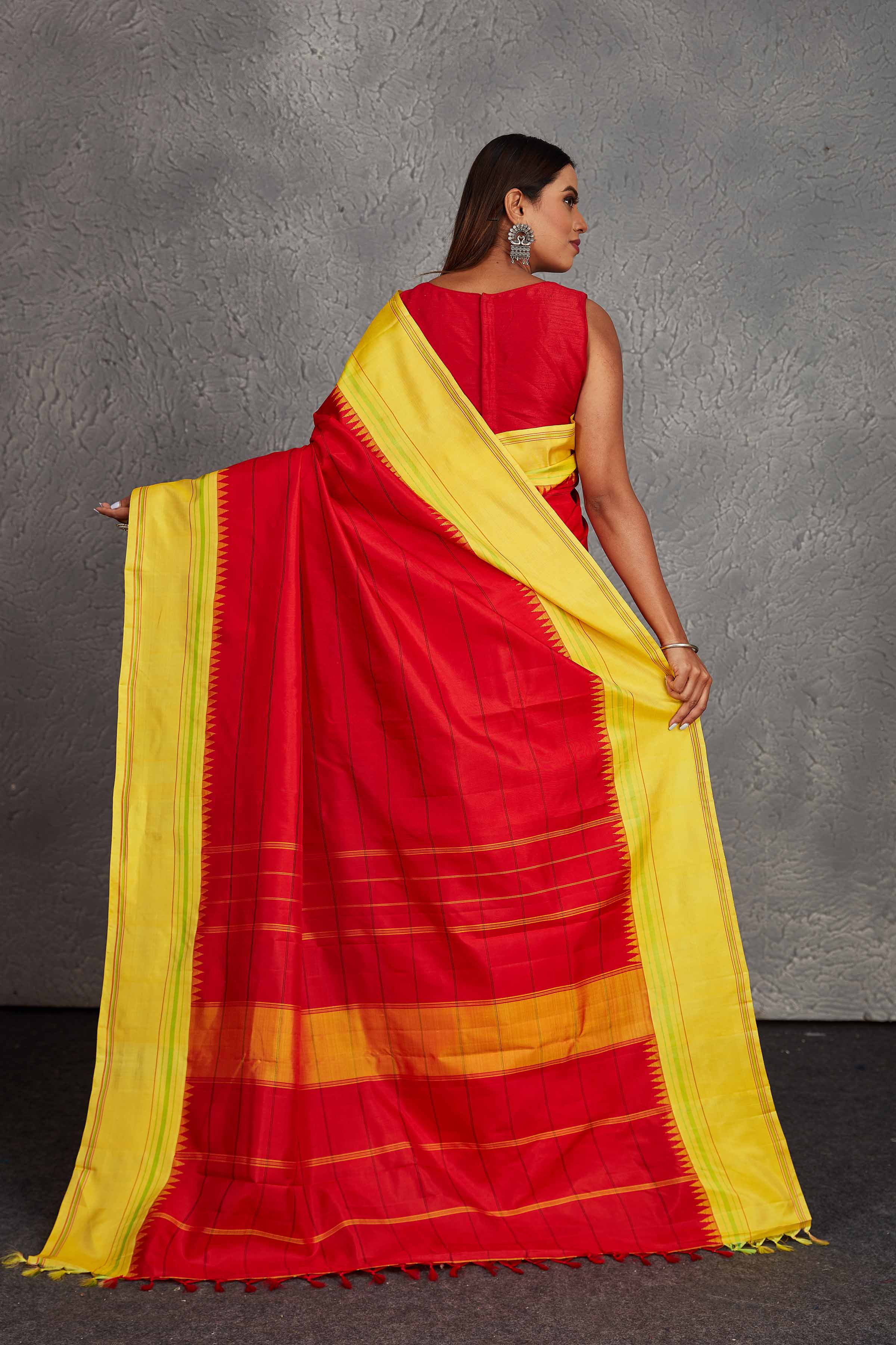 Shop beautiful red Kanjivaram silk saree online in USA with yellow border. Get festive ready in beautiful Kanchipuram silk saris, pure silk sarees, soft silk sarees, tussar silk saris, handwoven sarees, chanderi silk sarees from Pure Elegance Indian fashion store in USA.-back