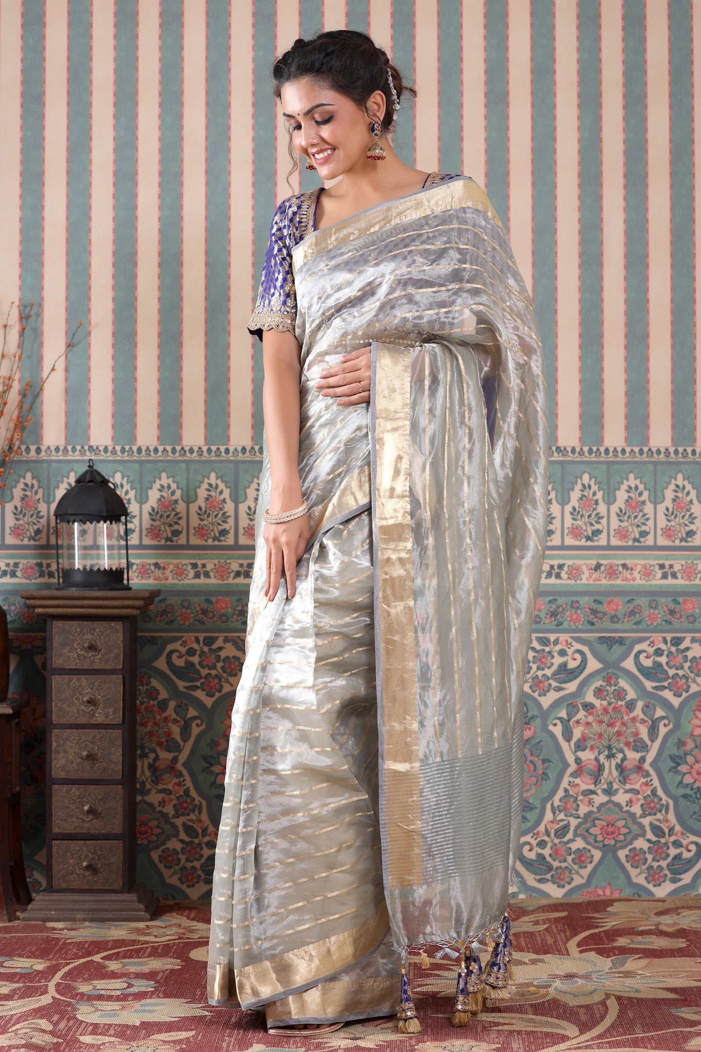 Buy grey striped tissue silk sari online in USA with blue saree blouse. Make a fashion statement at weddings with stunning designer sarees, embroidered sarees with blouse, wedding sarees, handloom sarees from Pure Elegance Indian fashion store in USA.-pallu