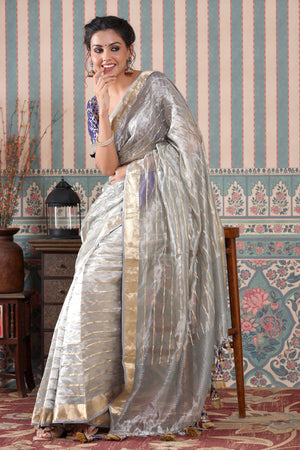 Buy grey striped tissue silk sari online in USA with blue saree blouse. Make a fashion statement at weddings with stunning designer sarees, embroidered sarees with blouse, wedding sarees, handloom sarees from Pure Elegance Indian fashion store in USA.-saree