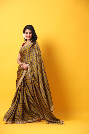 Buy mustard printed georgette sari online in USA with embroidered lace border. Make a fashion statement at weddings with stunning designer sarees, embroidered sarees with blouse, wedding sarees, handloom sarees from Pure Elegance Indian fashion store in USA.-pallu
