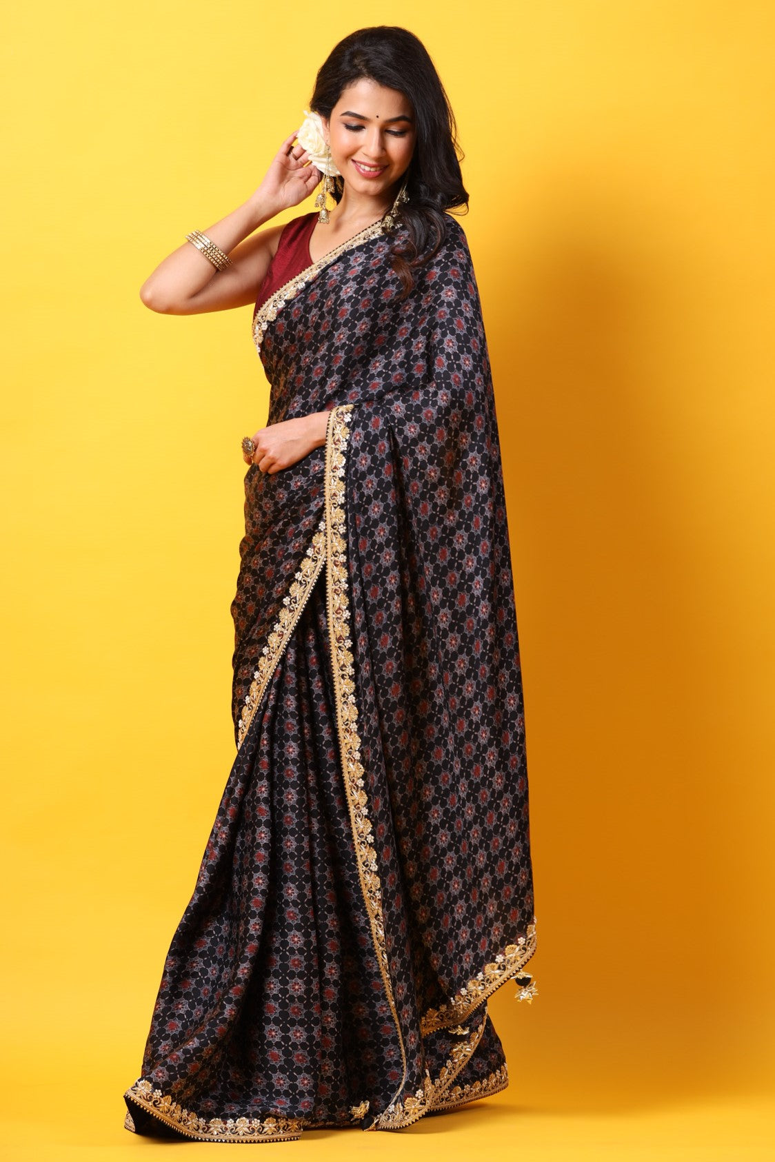 Buy black printed georgette sari online in USA with lace border. Make a fashion statement at weddings with stunning designer sarees, embroidered sarees with blouse, wedding sarees, handloom sarees from Pure Elegance Indian fashion store in USA.-front