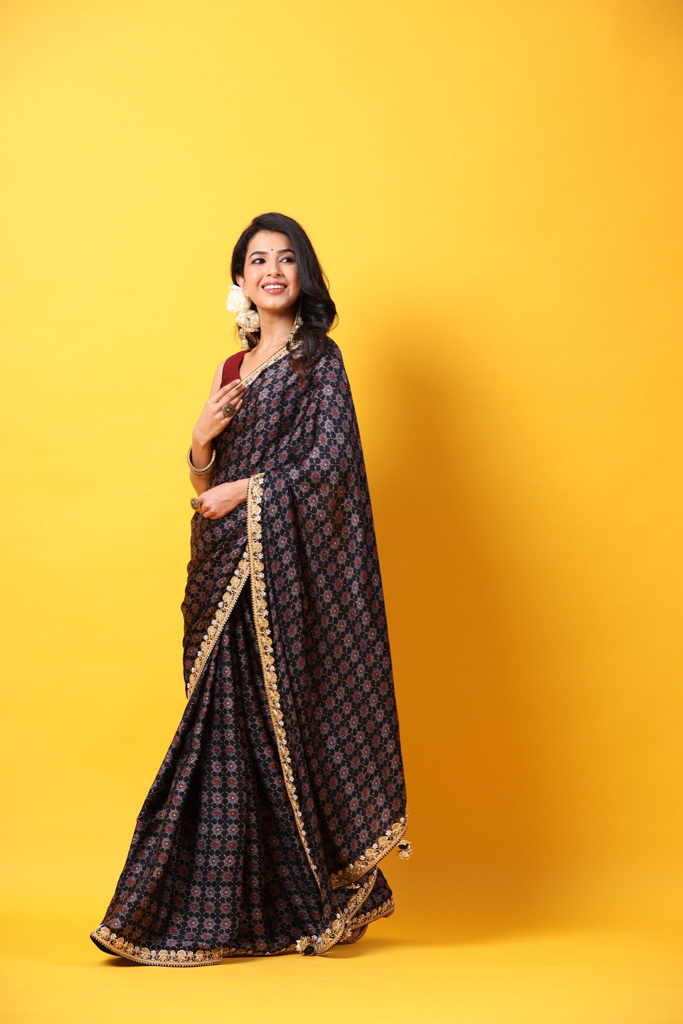 Buy black printed georgette sari online in USA with lace border. Make a fashion statement at weddings with stunning designer sarees, embroidered sarees with blouse, wedding sarees, handloom sarees from Pure Elegance Indian fashion store in USA.-side