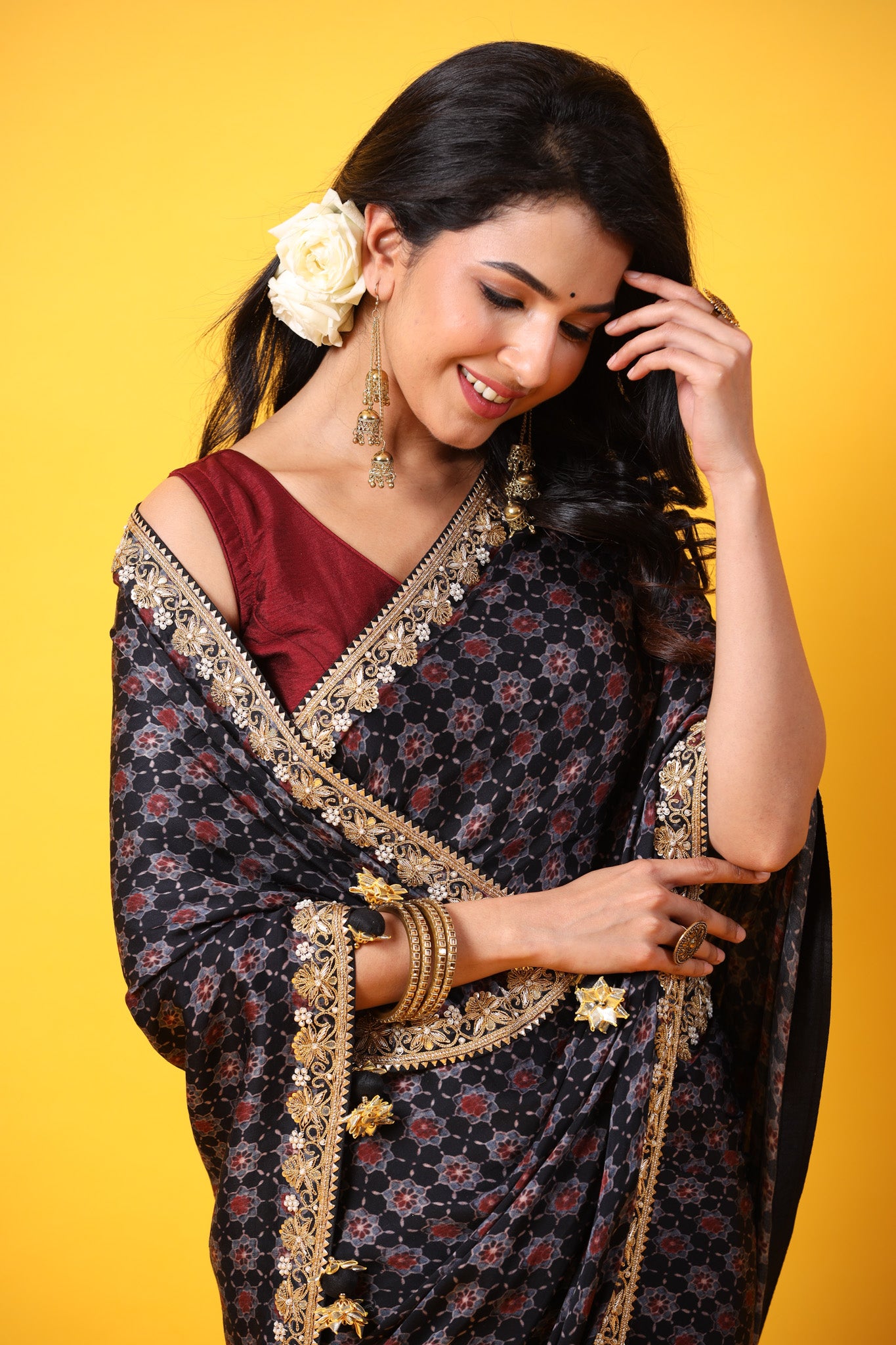 Buy black printed georgette sari online in USA with lace border. Make a fashion statement at weddings with stunning designer sarees, embroidered sarees with blouse, wedding sarees, handloom sarees from Pure Elegance Indian fashion store in USA.-closeup