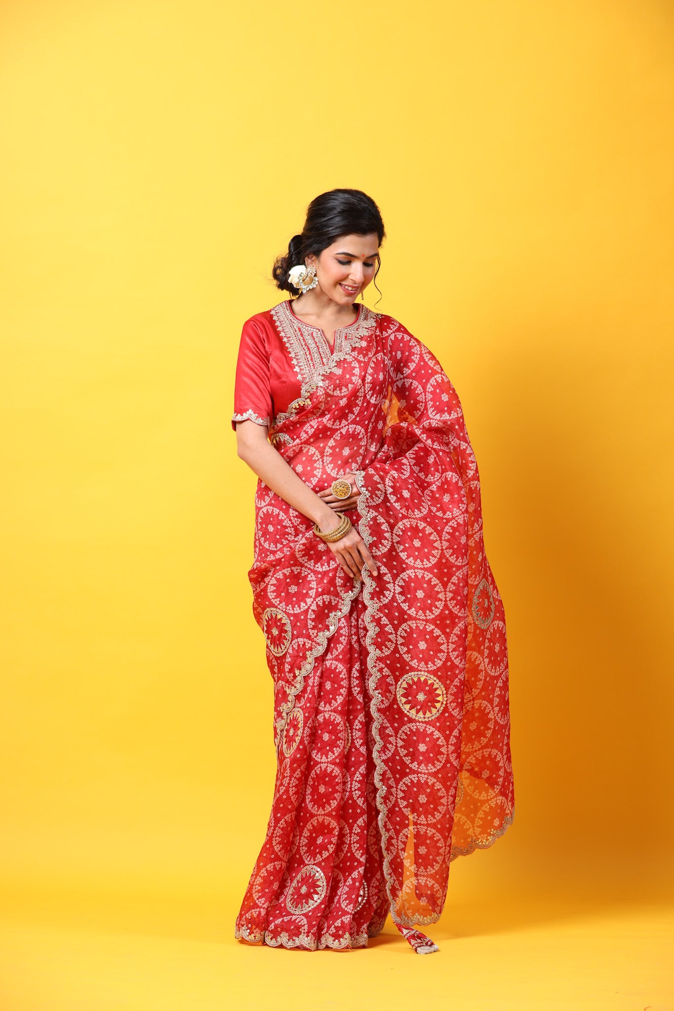 Buy red printed organza sari online in USA with embroidered scalloped border. Make a fashion statement at weddings with stunning designer sarees, embroidered sarees with blouse, wedding sarees, handloom sarees from Pure Elegance Indian fashion store in USA.-front