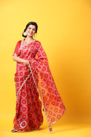 Buy red printed organza sari online in USA with embroidered scalloped border. Make a fashion statement at weddings with stunning designer sarees, embroidered sarees with blouse, wedding sarees, handloom sarees from Pure Elegance Indian fashion store in USA.-pallu