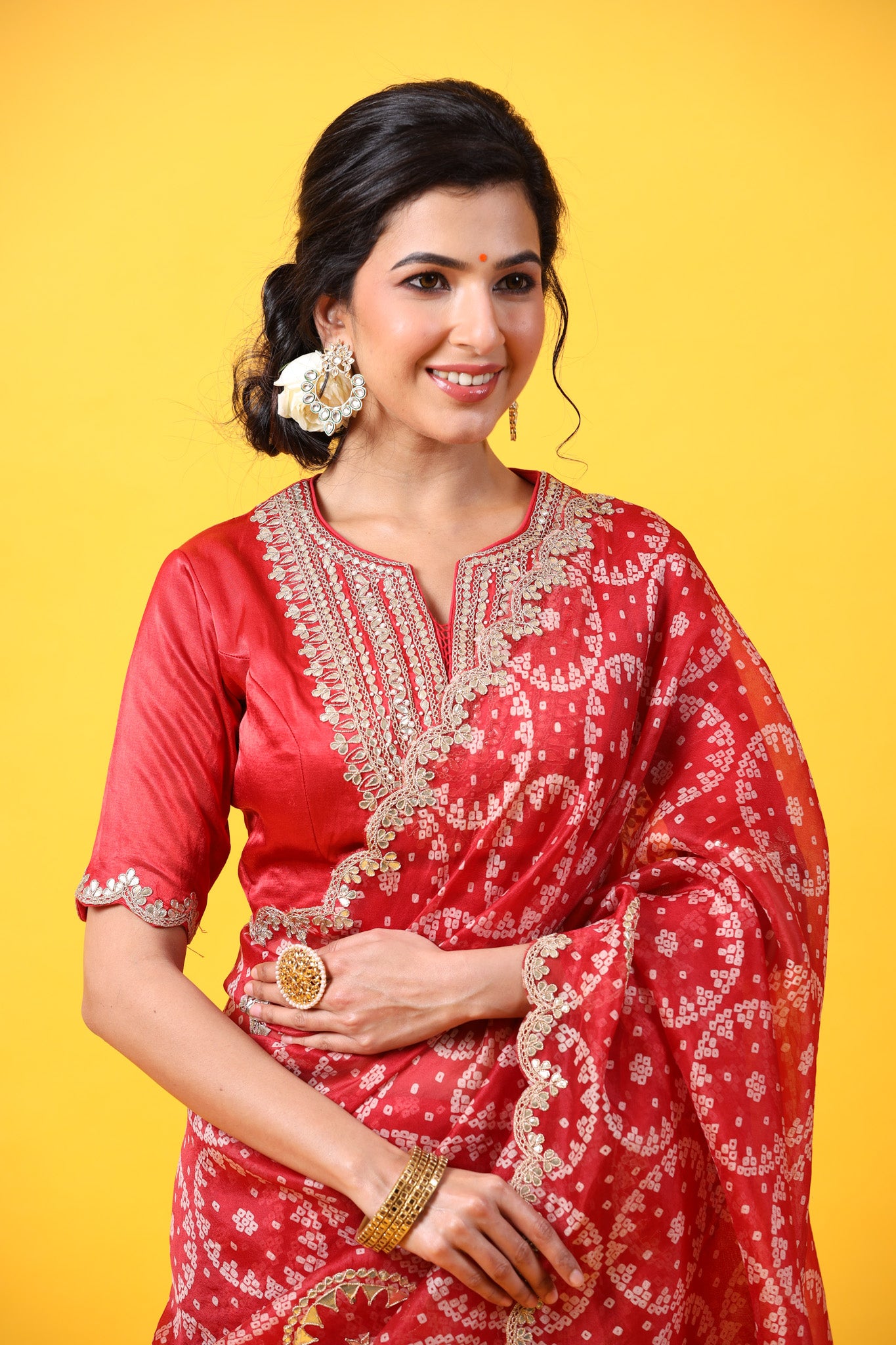 Buy red printed organza sari online in USA with embroidered scalloped border. Make a fashion statement at weddings with stunning designer sarees, embroidered sarees with blouse, wedding sarees, handloom sarees from Pure Elegance Indian fashion store in USA.-closeup