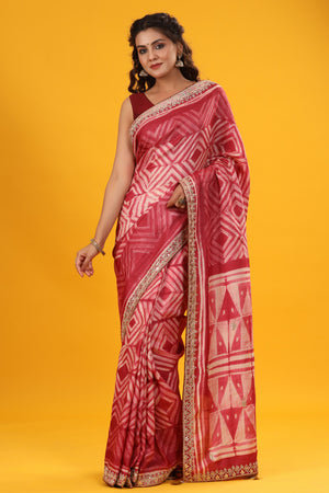 Shop red printed tussar silk sari online in USA with embroidered border. Make a fashion statement at weddings with stunning designer sarees, embroidered sarees with blouse, wedding sarees, handloom sarees from Pure Elegance Indian fashion store in USA.-front