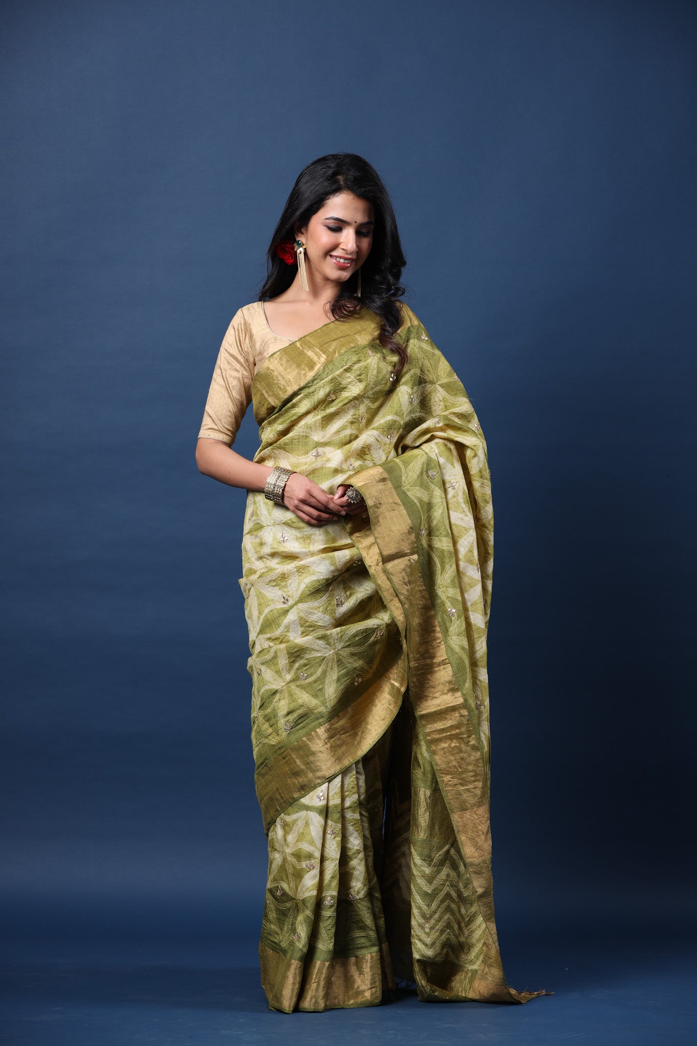 Buy olive green printed tussar silk sari online in USA with golden zari border. Make a fashion statement at weddings with stunning designer sarees, embroidered sarees with blouse, wedding sarees, handloom sarees from Pure Elegance Indian fashion store in USA.-front