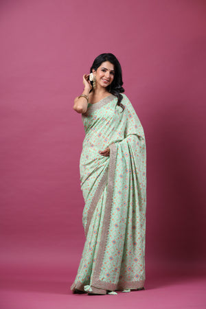 Shop mint green mulberry silk sari online in USA with embroidered border. Make a fashion statement at weddings with stunning designer sarees, embroidered sarees with blouse, wedding sarees, handloom sarees from Pure Elegance Indian fashion store in USA.-side
